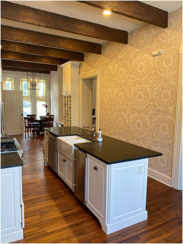 Wide plank floors in the historic home grace the kitchen