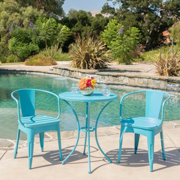 Colorful bistro set on a pool deck.